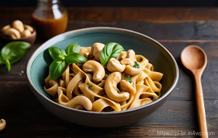 대체 식품을 활용한 크리미한 소스 만들기 - **Prompt:** A close-up, top-down shot of a beautifully plated vegan creamy cashew pasta. The fettucc...